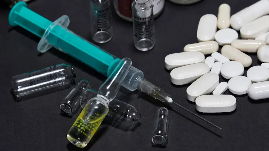 A Syringe And Pills