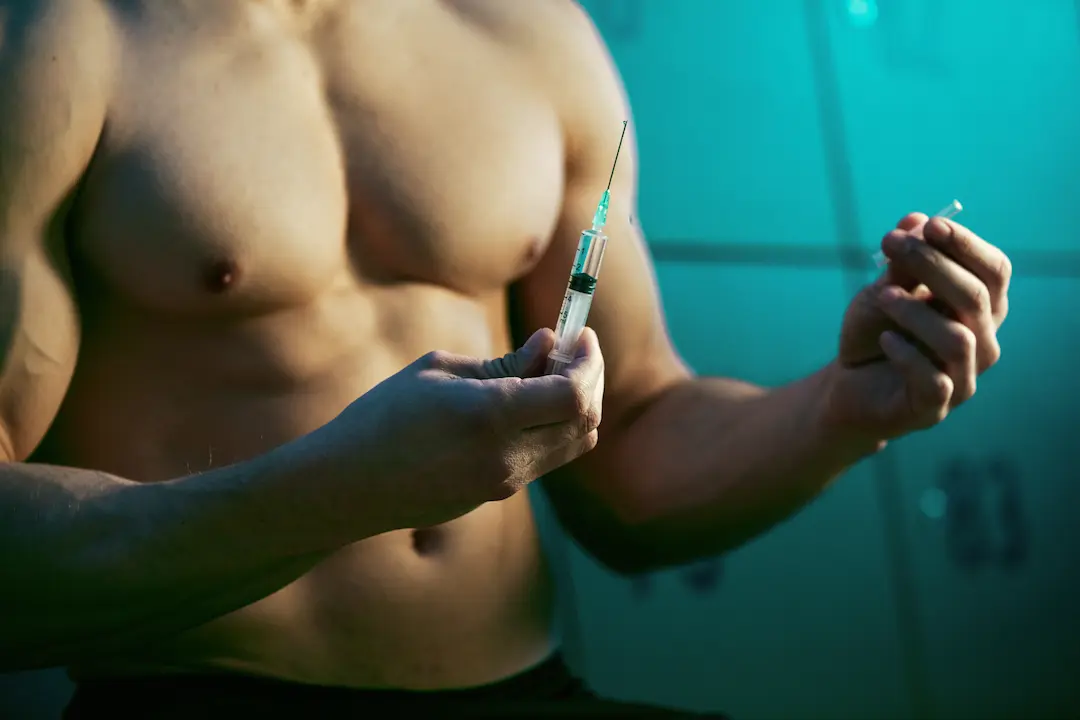 Man Holding Needle And Syringe Preparing To Testosterone Injection 