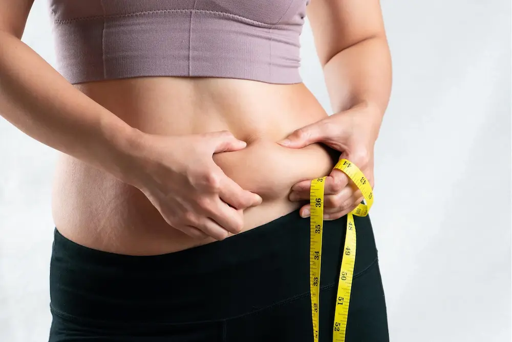 Women Measuring Her Weight Loss