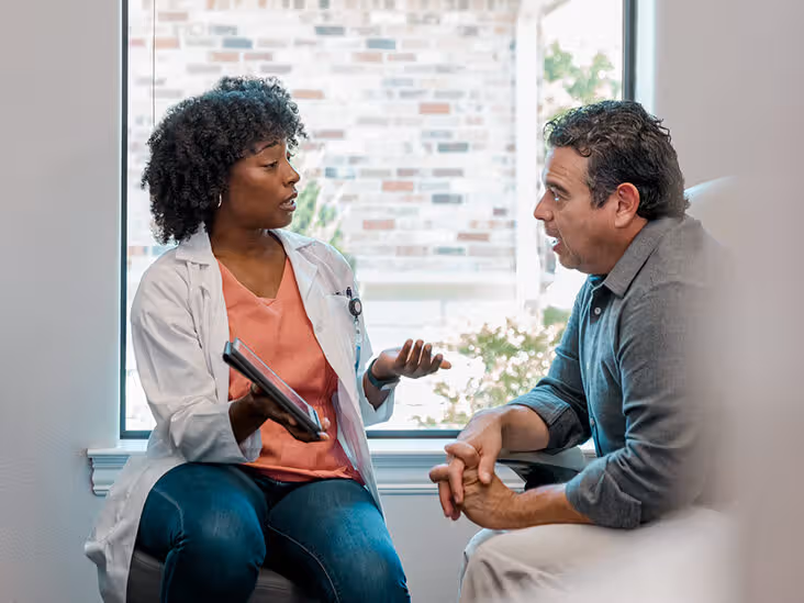 Doctors Explain Test Results To Male Patient About Estrogen Blockers For Men. 